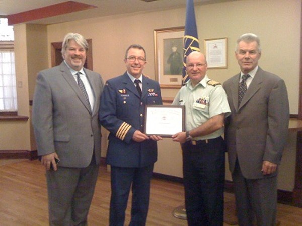 Together at the September luncheon are (l-r) Wayne Teeple, president of Phirelight, the luncheon sponsor; Col. Andre Boucher, Canadian Armed Forces, director, cyber force development, Department of National Defence; Col. Martin Girard, Canadian Armed Forces, chapter president; and Bob Koblovsky with Phirelight.